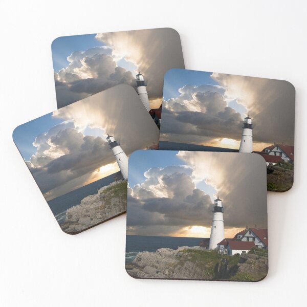 Item preview, Historic White Lighthouse On Rocky Coast Under Dramatic Sunset Sky designed and sold by simonwarz.