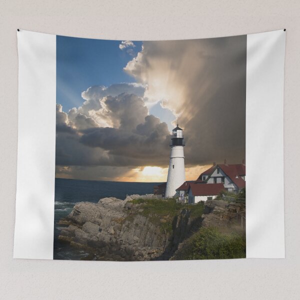 Item preview, Historic White Lighthouse On Rocky Coast Under Dramatic Sunset Sky designed and sold by simonwarz.
