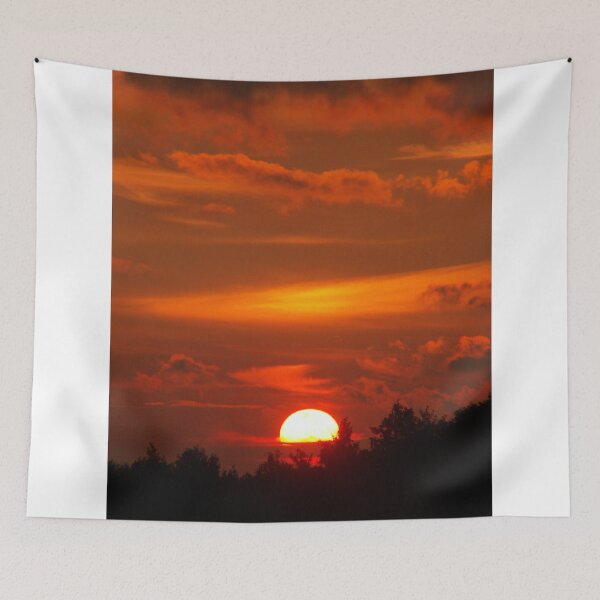 Item preview, Vibrant Red Sunset Sky Over Silhouetted Tree Line designed and sold by simonwarz.