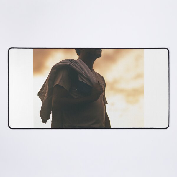 Item preview, Silhouette Portrait Of Young Man Holding Jacket At Sunset designed and sold by simonwarz.