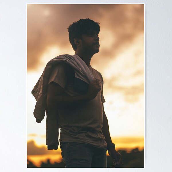 Item preview, Silhouette Portrait Of Young Man Holding Jacket At Sunset designed and sold by simonwarz.