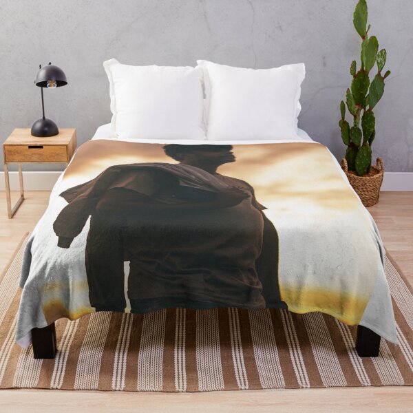 Item preview, Silhouette Portrait Of Young Man Holding Jacket At Sunset designed and sold by simonwarz.