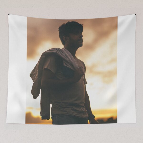 Item preview, Silhouette Portrait Of Young Man Holding Jacket At Sunset designed and sold by simonwarz.