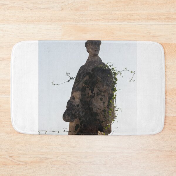 Item preview, Weathered Stone Statue Overgrown With Vines Against Bright Sky, Urban Ruin and Decay Scene designed and sold by Nmallia.