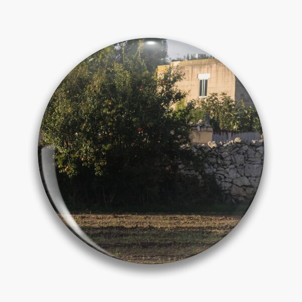 Item preview, Sunlit Rural Field With Stone Wall and Tree Near Farmhouse in Mediterranean Countryside designed and sold by Nmallia.