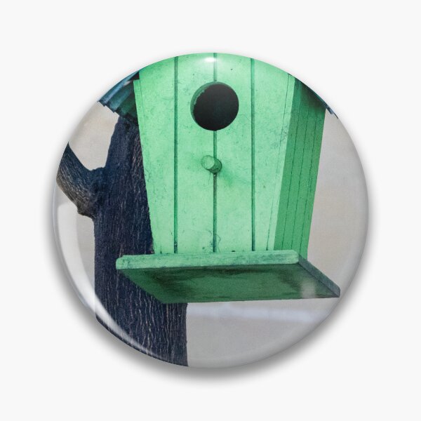 Item preview, Green Wooden Birdhouse Mounted On Tree Trunk In Backyard Garden Close-Up designed and sold by Nmallia.
