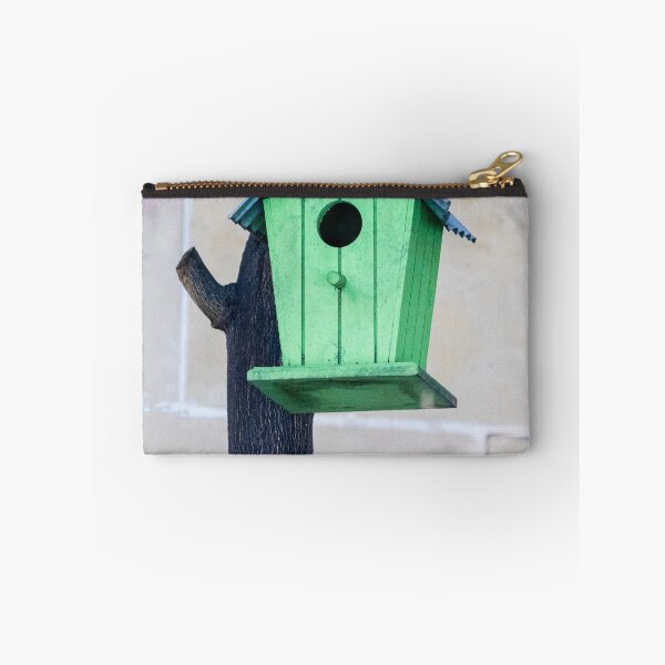 Item preview, Green Wooden Birdhouse Mounted On Tree Trunk In Backyard Garden Close-Up designed and sold by Nmallia.
