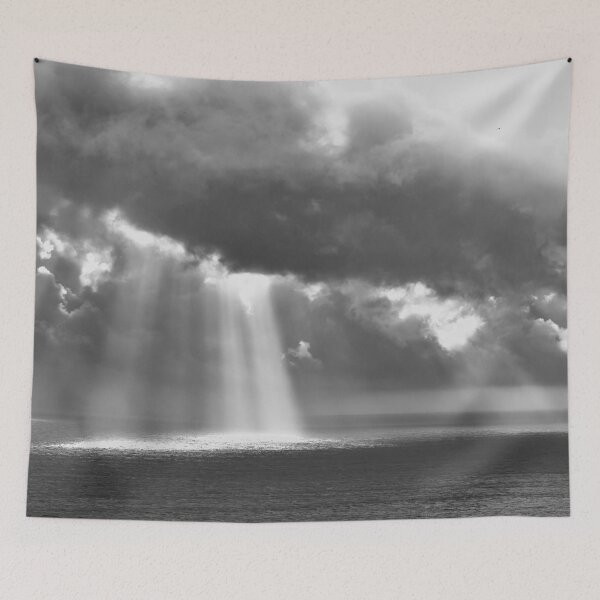 Item preview, Ray of light breaking through the clouds over the sea black and white photographic art print wall decor designed and sold by Astrid Arkhangelsky.