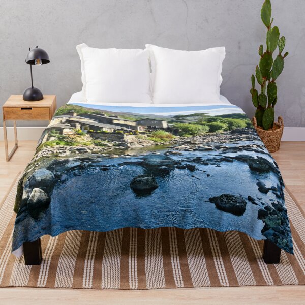 Item preview, Beddgelert village in Snowdonia, Wales, with traditional stone cottages beside a rocky river and dramatic mountain scenery. designed and sold by Kevin Hellon.
