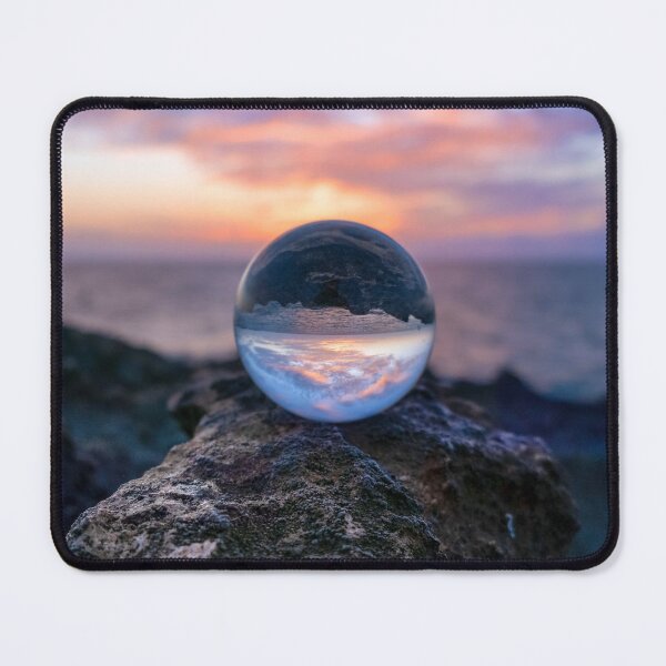 Item preview, Lensball sitting on a rock at sunset designed and sold by LayeredHorizons.