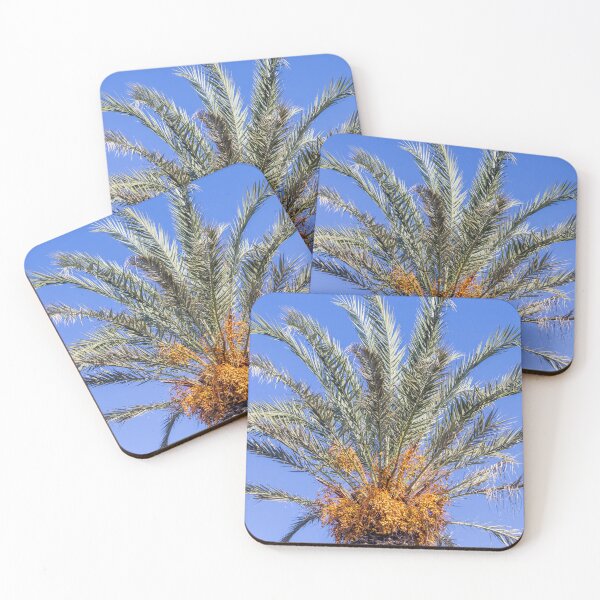 Item preview, Close-Up Top of Date Palm Tree With Ripe Fruit Clusters Against Clear Blue Sky designed and sold by Nmallia.