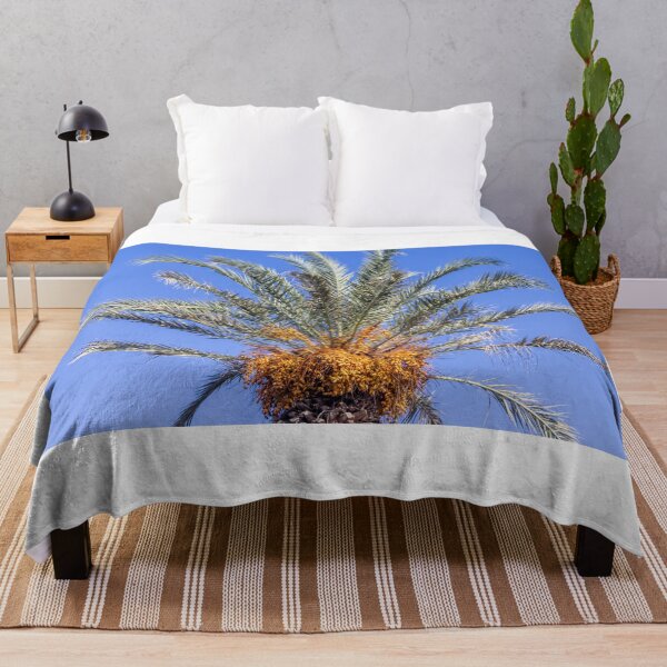 Item preview, Close-Up Top of Date Palm Tree With Ripe Fruit Clusters Against Clear Blue Sky designed and sold by Nmallia.