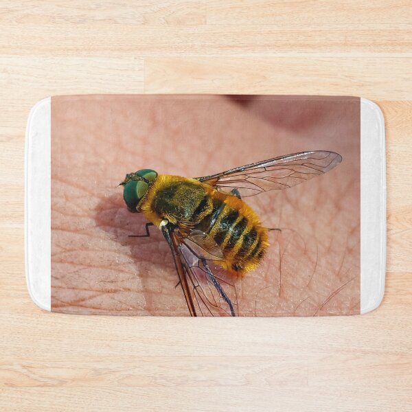 Item preview, Macro View Of Hairy Bee Fly Resting On Human Skin designed and sold by annendho.