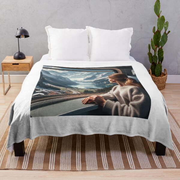 Item preview, Woman traveling by train through alpine scenery, with views of snow-capped mountains and lakes designed and sold by AndreaMart.