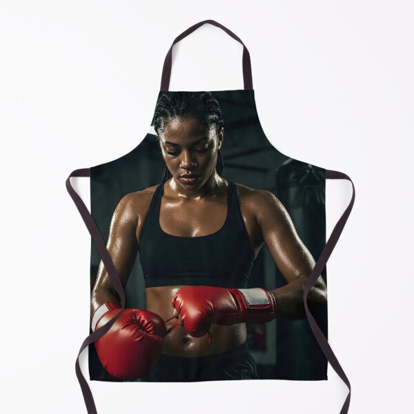 Item preview, A female boxer with sweaty skin and red boxing gloves in a gym, looking focused and determined designed and sold by homydesign.
