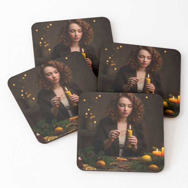 Item preview, Young adult female with curly red hair lighting a beeswax candle at a rustic table decorated with festive natural elements designed and sold by homydesign.