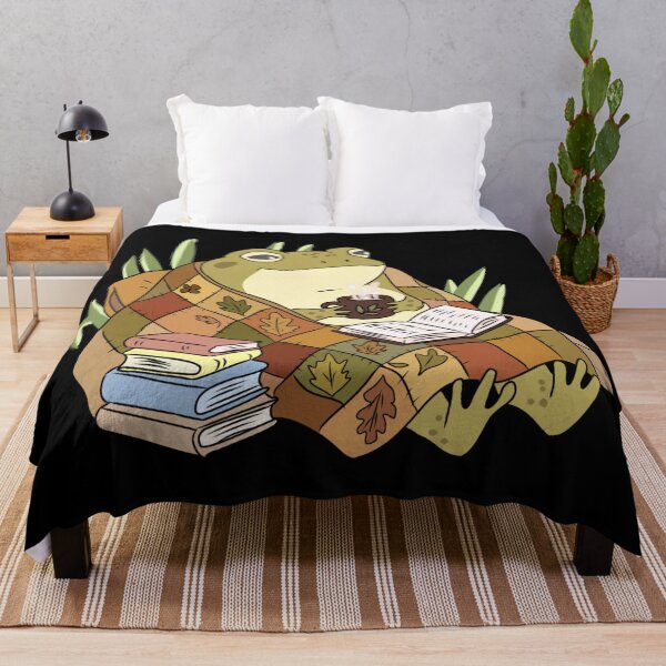 Item preview, Frog Reading Book Under Quilt Blankets Drinking Coffee Cottagecore Illustration designed and sold by LeshanArt.