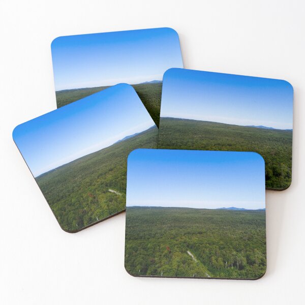Item preview, Aerial Panorama of Vast Green Forest and Distant Mountains Under Clear Blue Sky designed and sold by celinebisson.