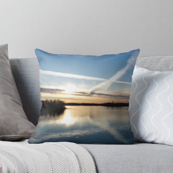 Item preview, Sunset Over Calm Lake with Airplane Contrails Crossing the Evening Sky designed and sold by celinebisson.