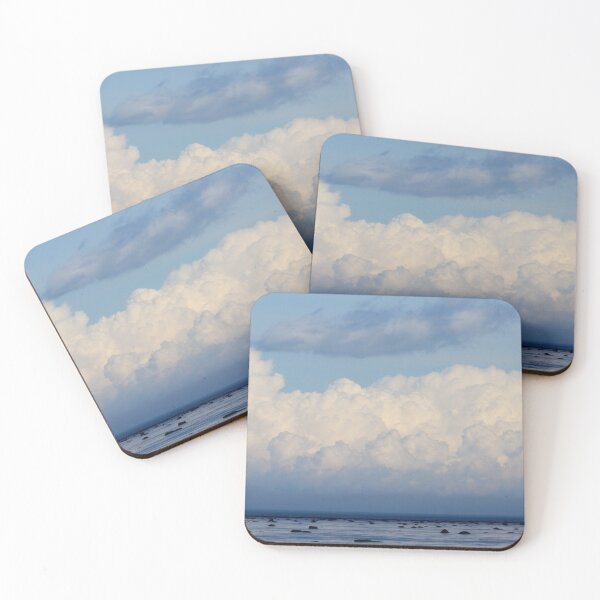 Item preview, Towering White Cumulus Clouds Over Blue Sea and Rocky Shoreline designed and sold by celinebisson.