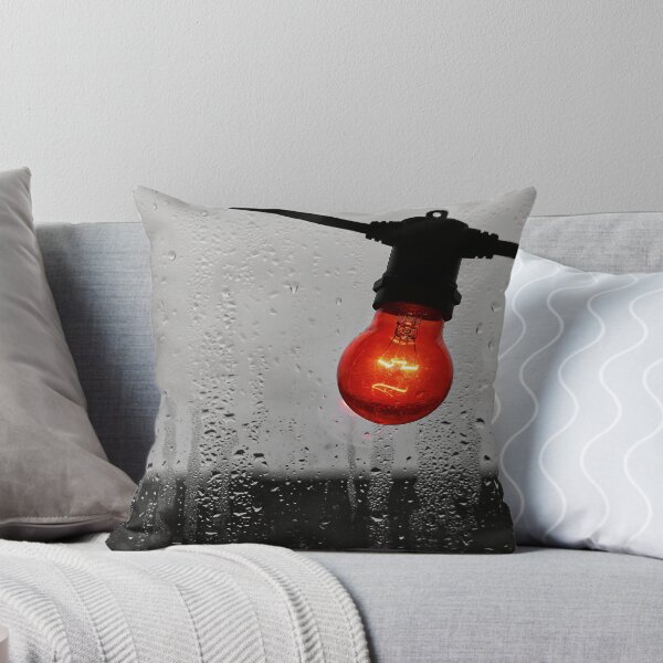 Item preview, Glowing Red Edison Light Bulb in front of a Rain Streaked Window designed and sold by ConcreteCandy.