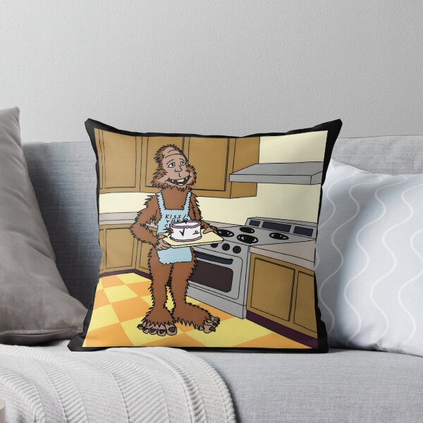 Item preview, Bigfoot Wearing Kiss The Cook Apron Holding Cake Cartoon designed and sold by J-Mindful.