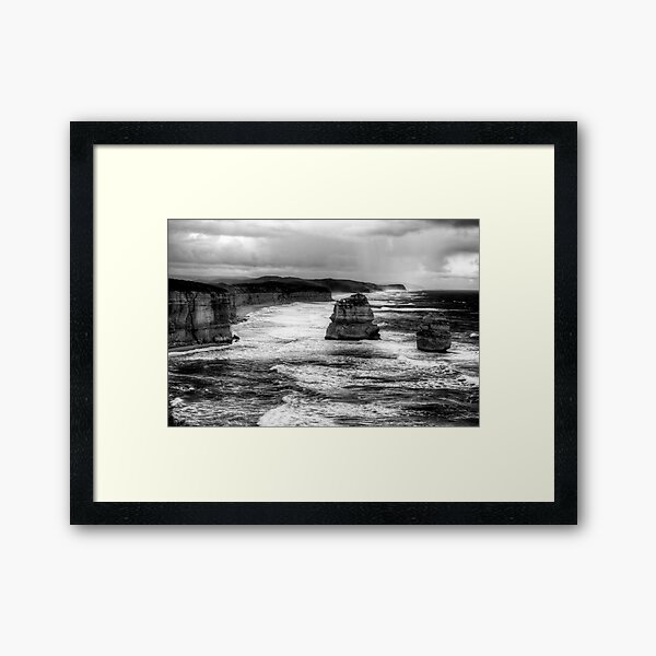 A late stormy afternoon with the twelve apostles in monochrome Framed Art Print