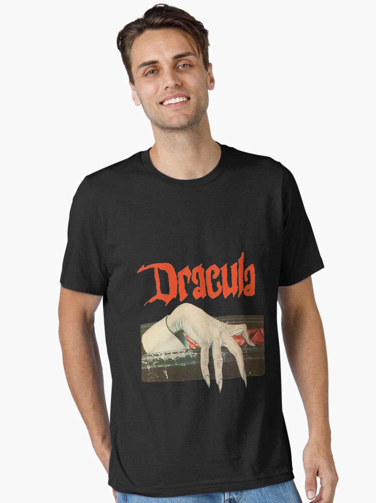 Imagen 1 de 7, Camiseta esencial con la obra Vintage Dracula, diseñada y vendida por TorpidNagware.