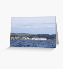 Laphroaig Distillery seen from the ocean under a vast blue sky Greeting Card