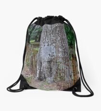Tree liked the fence just where it was! Drawstring Bag