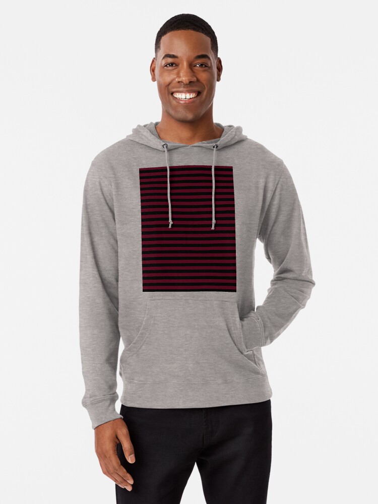 black hoodie with red stripes on sleeves