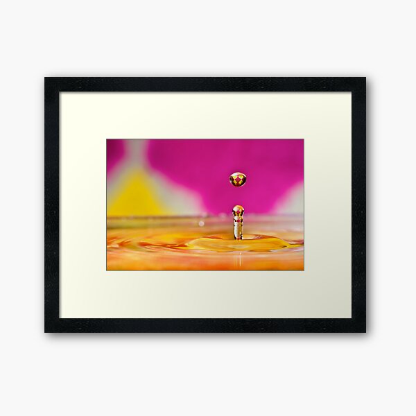 Jumping water drop Framed Art Print
