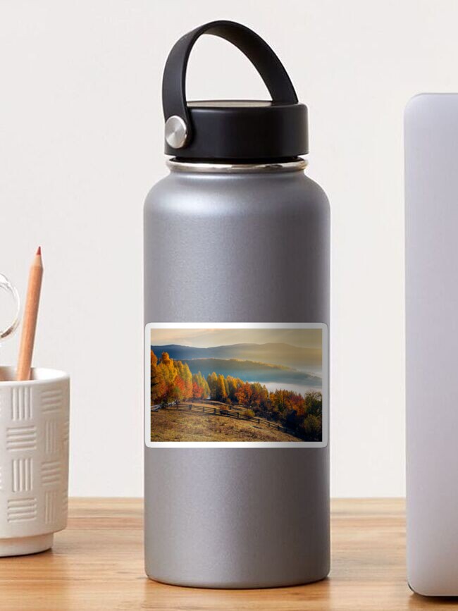Thumbnail 1 of 3, Sticker, rural field and orchard in autumn at sunrise designed and sold by mike-pellinni.