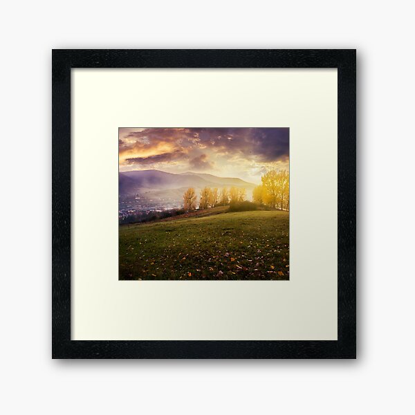 cloudy sunrise in mountains Framed Art Print