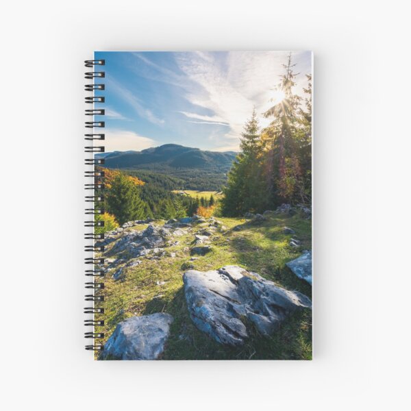 rocky cliff above the forested valley Spiral Notebook