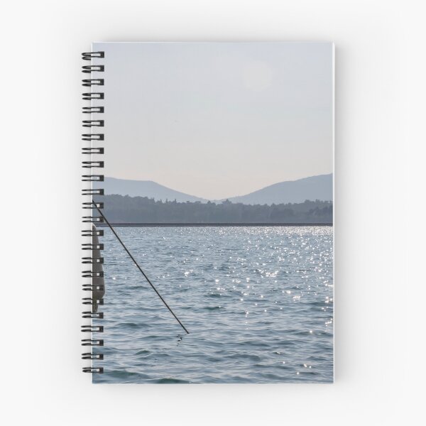 Item preview, Board the yacht in the marina. The glare of the sun on the water. Mountains silhouettes.  designed and sold by EG Creativity Art.
