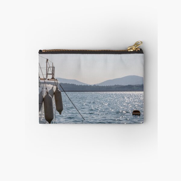 Item preview, Board the yacht in the marina. The glare of the sun on the water. Mountains silhouettes.  designed and sold by EG Creativity Art.