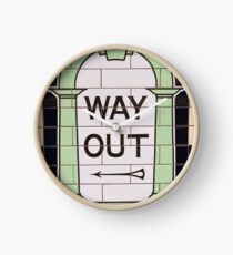 Way out sign in London underground station. UK. Clock