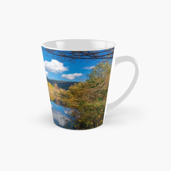 Item preview, Hojas de otoño y cielo azul reflejado en el agua cerca de Aberfoyle en los Trossachs, Escocia, Reino Unido designed and sold by marthadoom.