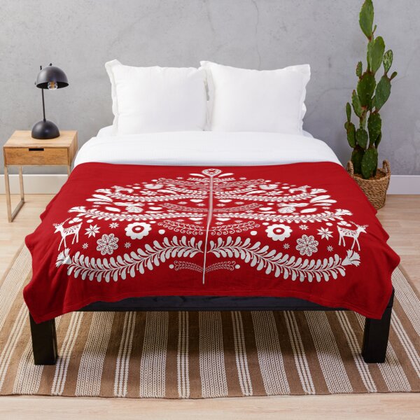 White Scandinavian Christmas Tree on Red Throw Blanket