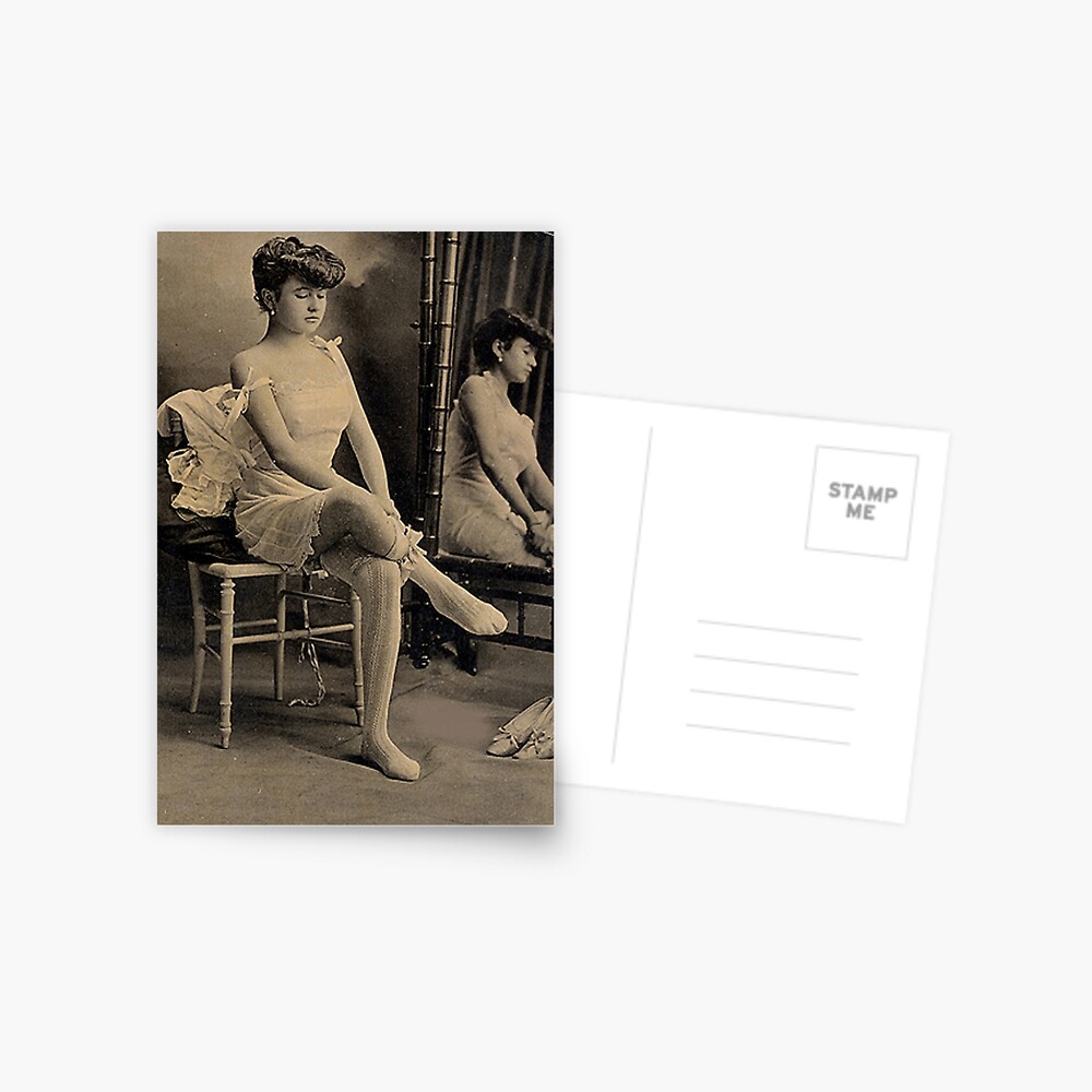 Vintage lady putting on socks photo Postcard
