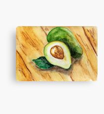 Watercolor illustration. Half of fresh raw avocado and whole avocado lying on a wooden surface. Canvas Print