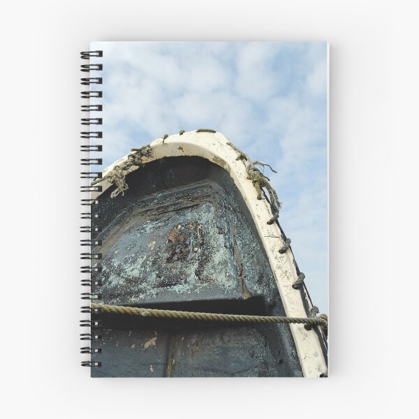Item preview, Old boat upright against cloudy Blue sky designed and sold by buttonpresser.