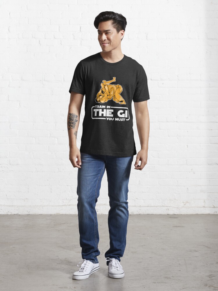 Essential T-Shirt mit Train In The Gi You Must - Martial Arts Gift, designt und verkauft von yeoys