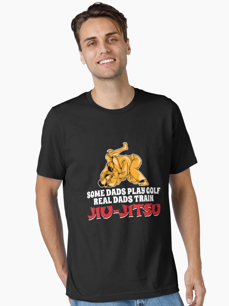 Thumbnail 1 von 7, Essential T-Shirt, Real Dads Train Jiu-Jitsu - Martial Arts Gift designt und verkauft von yeoys.