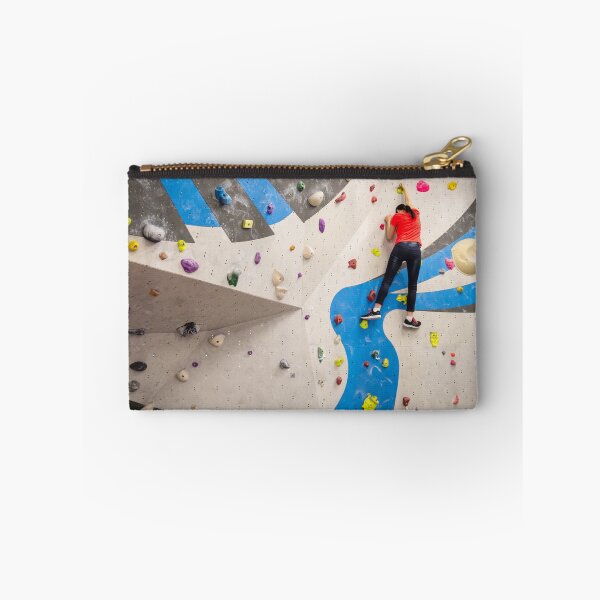Item preview, Active young climber woman climbing on indoor climbing wall designed and sold by Maor Winetrob.