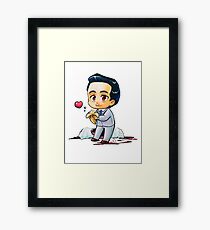 Moriarty eats a banana Framed Print