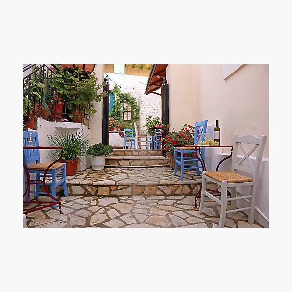 Wine and grapes on the table street in Parga Greece Photographic Print