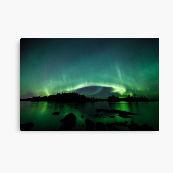 Beautiful northern lights over lake Canvas Print