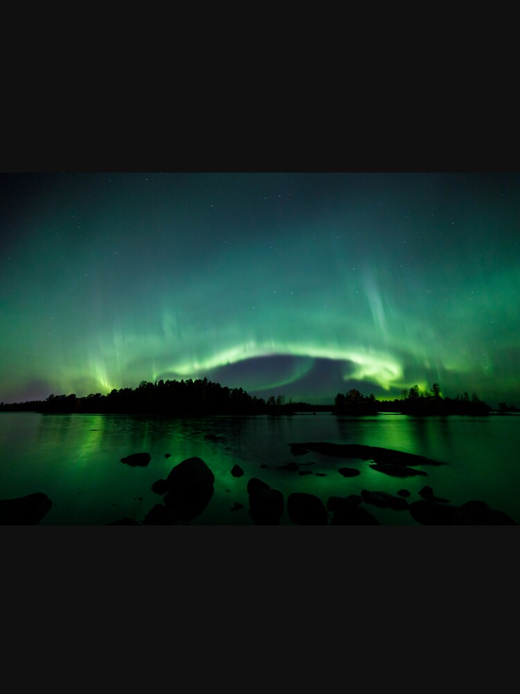 Beautiful northern lights over lake by Juhku